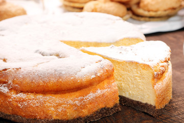 Cheesecake in bakery mold removed from the oven