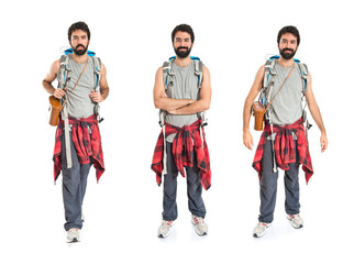 Backpacker with his arms crossed over white background