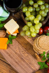 wooden board with oat cakes and cheese