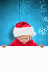 Composite image of festive little girl showing poster