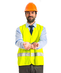 workman holding something over white background