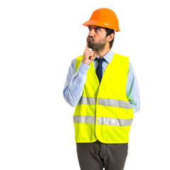 worker thinking over white background