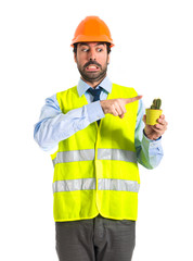 Worker holding a cactus