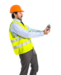 Worker holding vintage clock