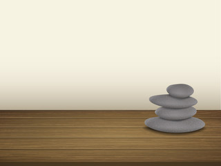 pebbles stack isolated on wooden floor