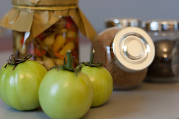 Still life composition with picle, spice and green tomatos