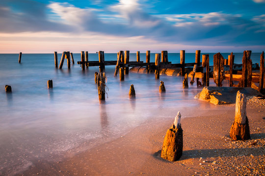 Long exposure at sunset of pier pilings in the Delaware Bay at S