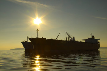 silhouette tanker on sunset background