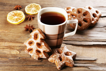 Cup of tea with cookies on table close-up