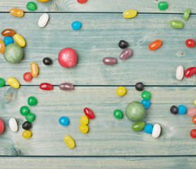 Candies lying over the wooden surface