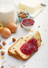 Healthy breakfast. Two slices of bread with jam on wooden table.