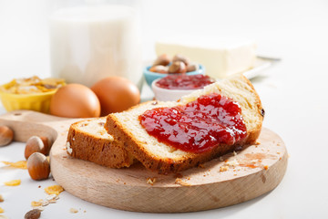 Healthy breakfast. Two slices of bread with jam on wooden table.
