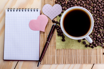 open notebook on the background of  cup of coffee