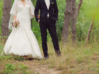 Fototapeta na wymiar Newlyweds Walking in Forest