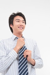 넥타이를 잡고 있는 아시안 비즈니스맨