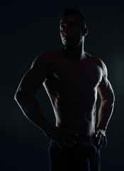 Fototapeta na wymiar Silhouette of a handsome muscular man