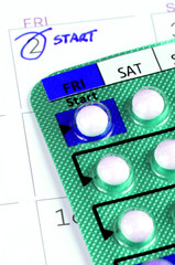 Strip of Contraceptive Pill on the Calendar with Start Taking Date Remark.