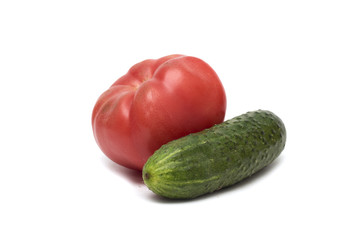 Red tomato and green cucumber. Photo.