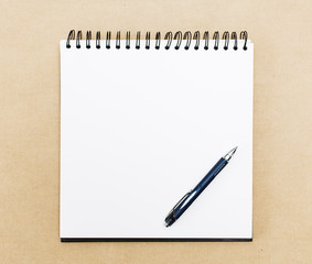 Blank notepad with pen on office  table