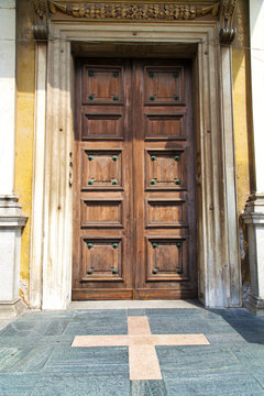 door   in italy    the milano old   church   closed brick  pavem