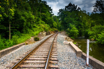 Railroad track along a creek in rural Carroll County, Maryland.