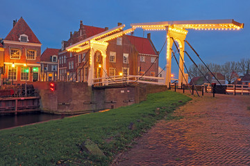 Medieval bridge and houses in the village Enkhuizen The Netherla