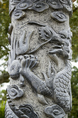 Close up view of a beautiful dragon pillar statue on a park.