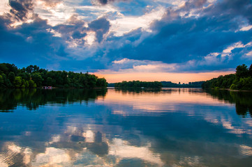 Reflection of trees and clouds at sunset in Lake Marburg, Codoru