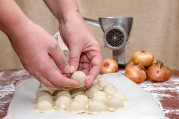 Obraz na płótnie Canvas Russian dumplings. The process of cooking.