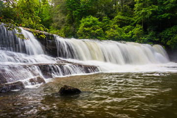 Fototapeta premium Side view of Hooker Falls on the Little River in Dupont State Fo