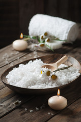 Fototapeta na wymiar Spa concept with daisy, white salt and candles
