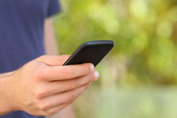 Man hand using a smart phone in green