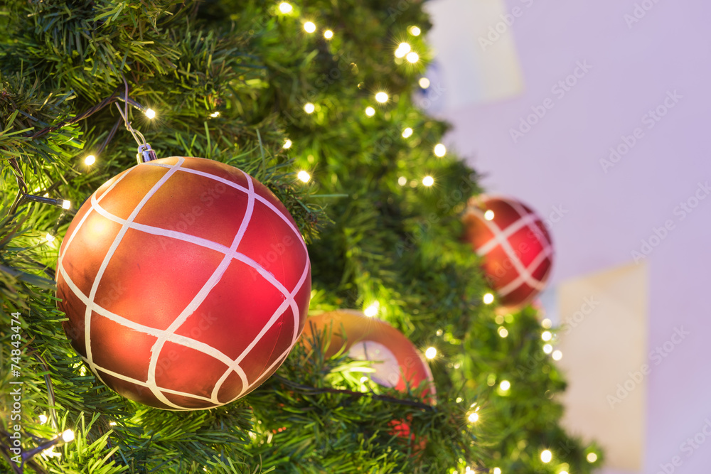 Wall mural red christmas ball on green christmas tree