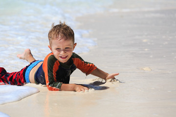 little boy enjoying sea on beach vacation