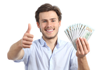 Young man holding money with thumbs up