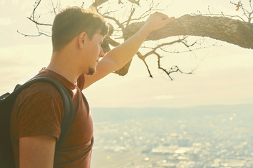 Traveler young man looking at the city