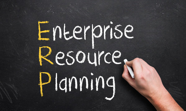 hand writing enterprise resource planning on a chalk board