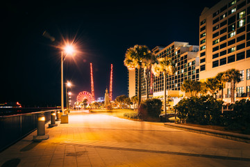 Fototapeta na wymiar The boardwalk at night in Daytona Beach, Florida.