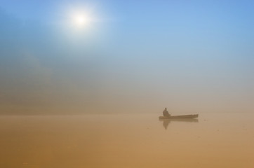 Fototapeta na wymiar Fisherman in boat