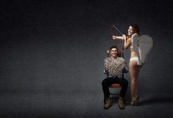 Cupid angel hitting male heart