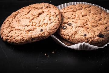 Oat cookies on the old shabby background. tinted
