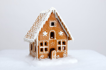 The hand-made eatable gingerbread house and snow decoration - 74856028