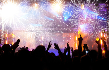 Fototapeta na wymiar Celebrating New year with champagne and fireworks