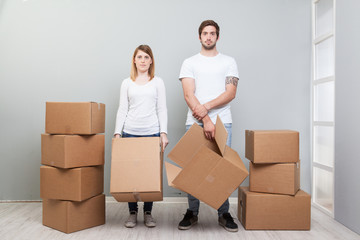 Smiling couple buying new furniture for their home