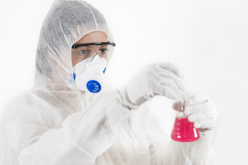 Young Woman wearing protective suit holding laboratory glassware