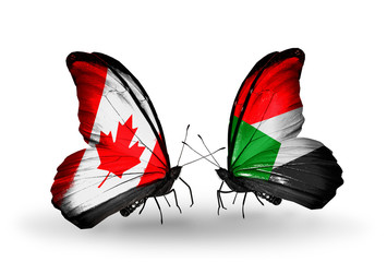 Two butterflies with flags Canada and Sudan