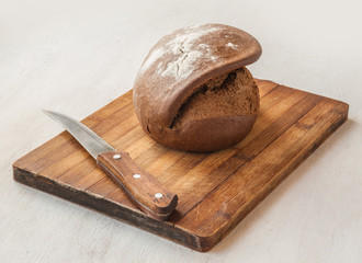 Fresh rye bread on the French recipe on cutting board