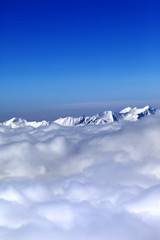 Fototapeta na wymiar Cloudy mountains at nice winter day