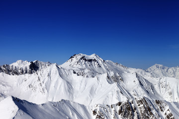 Snowy mountains in sun day