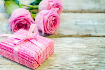 Valentine's background with gift and flowers